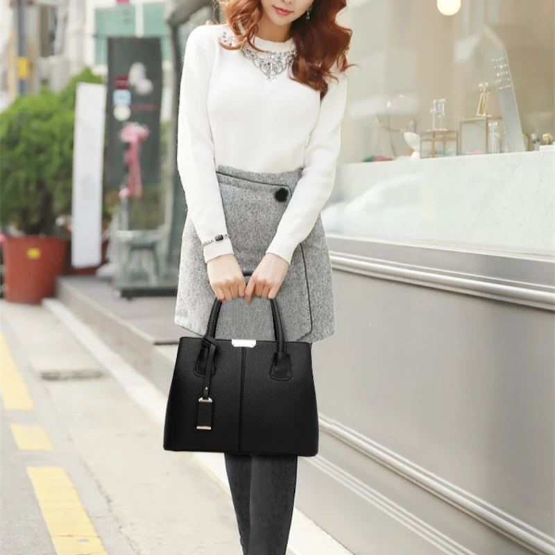 Smaller, structured bags with adjustable, branded straps.