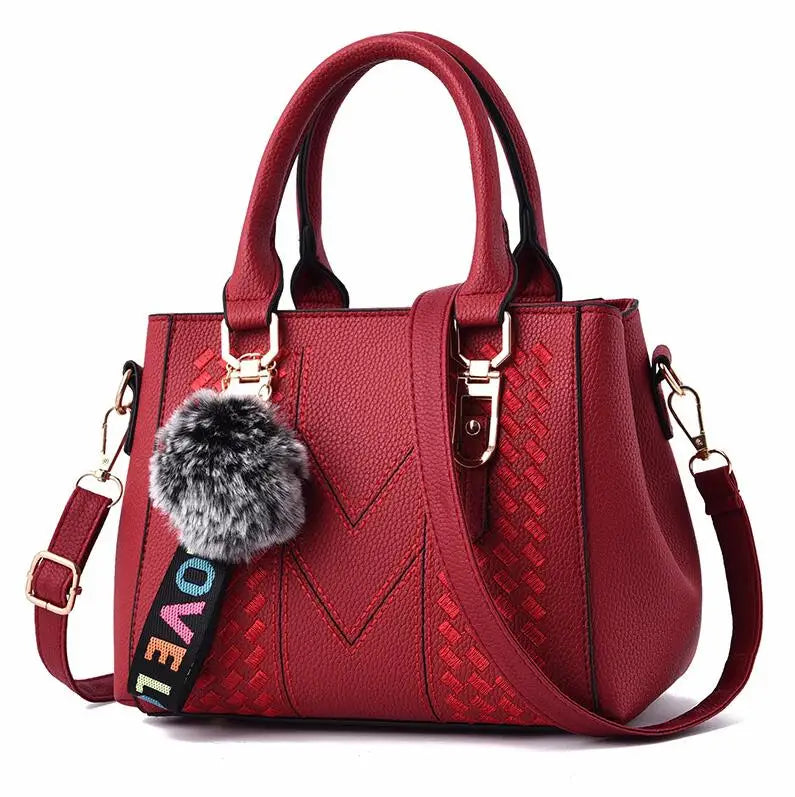 Premium Leather Messenger Bag – Intricate Floral Embroidery & Trendy Hairball Detail for Ladies