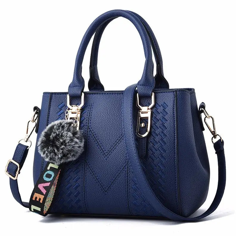 Premium Leather Messenger Bag – Intricate Floral Embroidery & Trendy Hairball Detail for Ladies