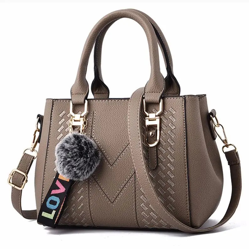 Premium Leather Messenger Bag – Intricate Floral Embroidery & Trendy Hairball Detail for Ladies