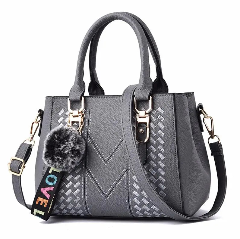Premium Leather Messenger Bag – Intricate Floral Embroidery & Trendy Hairball Detail for Ladies