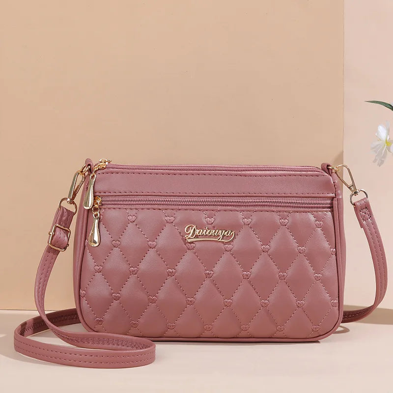 Premium Leather Messenger Bag – Intricate Floral Embroidery & Trendy Hairball Detail for Ladies