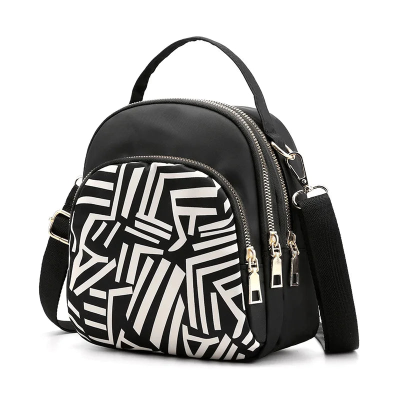 Smaller, structured bags with adjustable, branded straps.
