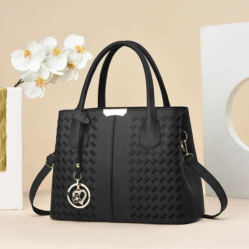 Smaller, structured bags with adjustable, branded straps.