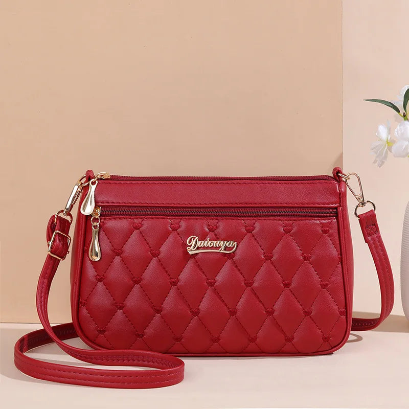 Premium Leather Messenger Bag – Intricate Floral Embroidery & Trendy Hairball Detail for Ladies