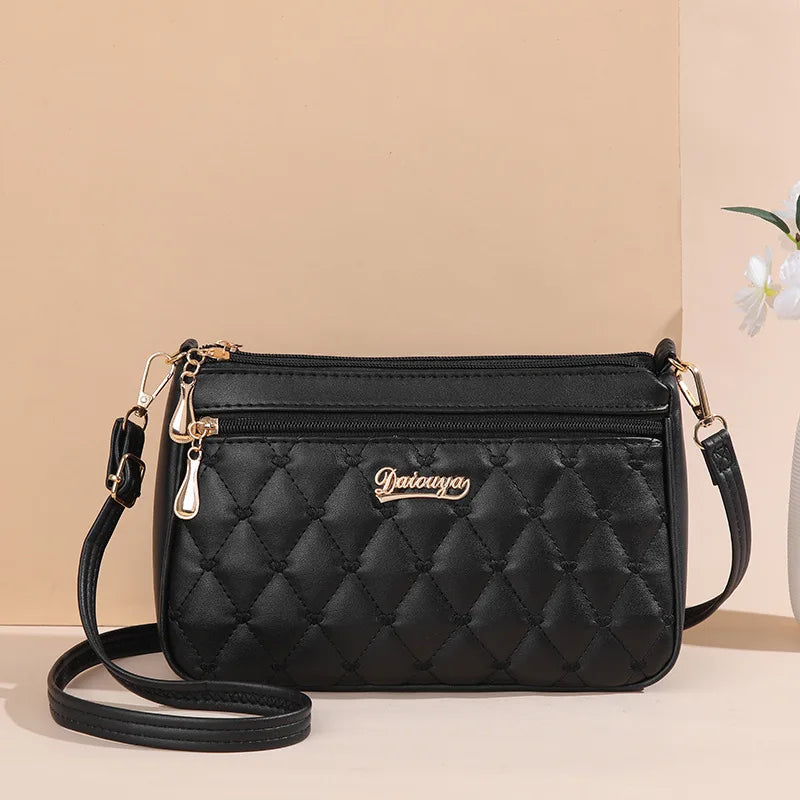 Premium Leather Messenger Bag – Intricate Floral Embroidery & Trendy Hairball Detail for Ladies